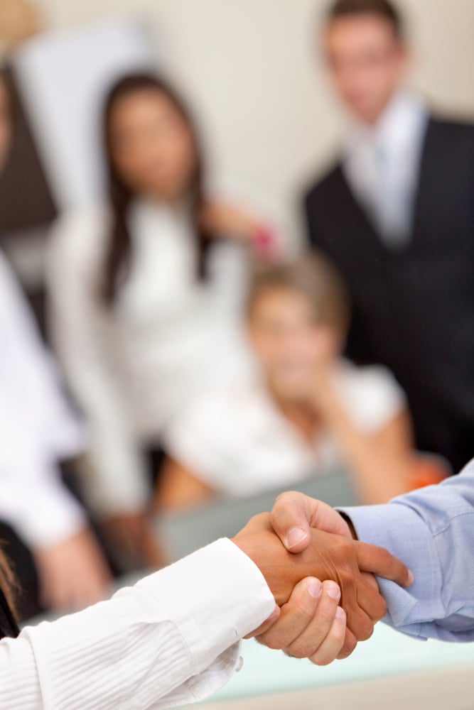 Close up of a business handshake at the office